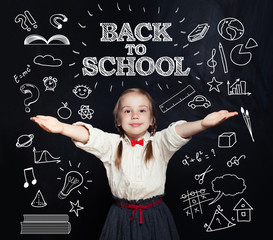 Back To School Concept, Happy Smiling Schoolgirl Studying and Having Fun on Blackboard Background