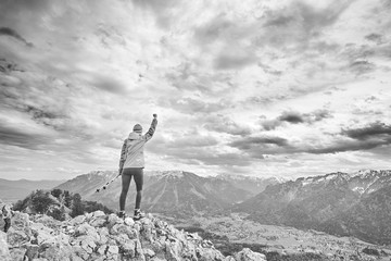 Woman on top of mountain