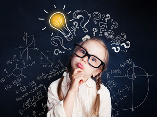 Small child mathematics student thinking on background with lightbulb and math formulas. Kid ideas