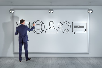 Businessman drawing thin line contact icon