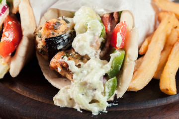 Gyros souvlaki wrapped in a pita bread