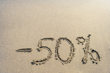 inscription on the sand minus fifty percent, 50 %,