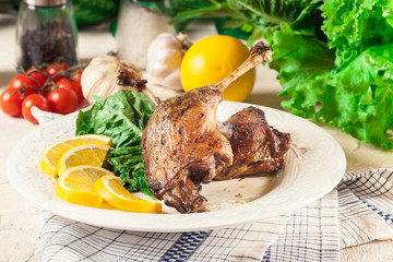 Duck legs confit with orange and salad