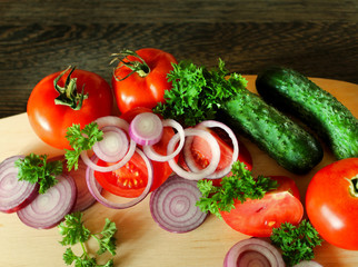 Fresh vegetables on the cutting Board on the table.