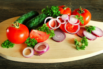 Fresh vegetables on the cutting Board on the table.