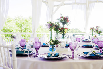 Wedding decoration. Wedding table decor in lavender and emerald