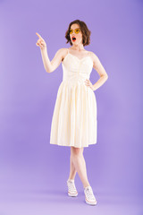 Full length portrait of a cheerful young woman
