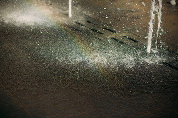 Rainbow apperead from the fountain. water in the city