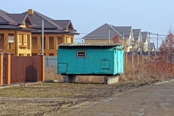 Fototapeta na wymiar green old military trailer stands on the street