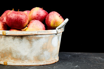 Fresh organic red apples in a basket