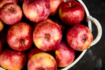 Fototapeta na wymiar Fresh organic red apples in a basket