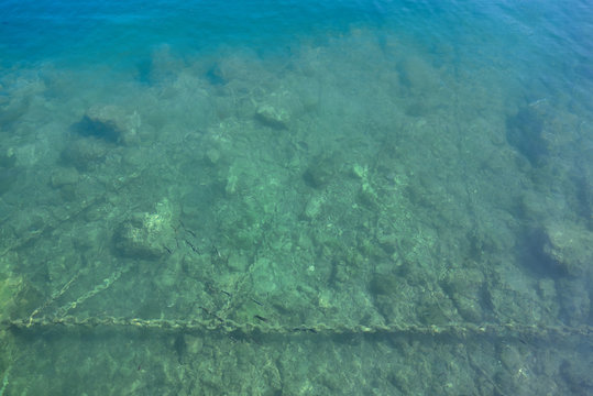 Seabed next to the dock, photo above the surface of the water