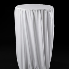 white tablecloth on a high round table for catering, empty table on a black background, isolate