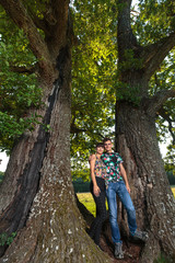 Naklejka na ściany i meble Couple under big oak tree