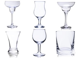 Empty glasses set on white background