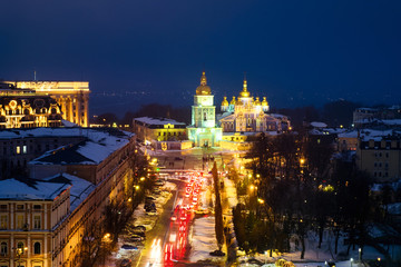 Fototapeta na wymiar Kyiv, Ukraine, with a view of the St Michaels Golden - Domed Monastery and traffic