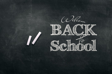 Inscription Back to school, chalk scribble background on blackboard. The concept of the day of knowledge, September 1, the beginning of classes.