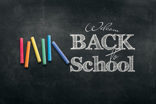 Inscription Back to school, chalk scribble background on blackboard. The concept of the day of knowledge, September 1, the beginning of classes.