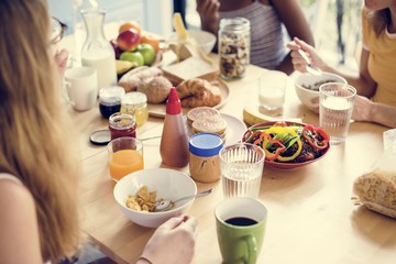 A group of diverse women having breakfast together