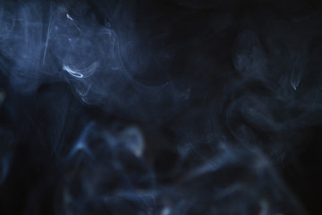 lovely flowing glowing bright smoke on the black background.