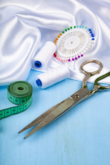 Sewing accessories on a blue  background