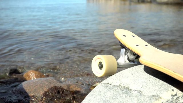 Longboard at the beach with north sea at the background Norway Kjerringvik