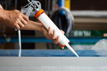 Glue gun for working with silicone adhesives and other construction fillers.