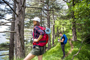Obraz premium Young couple on their hiking trip.Hikers exploring nature