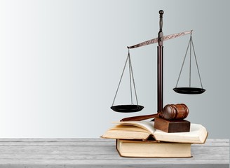 Justice Scales and books with wooden gavel on table. Justice