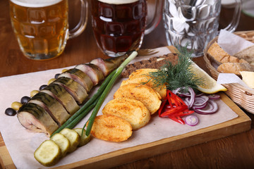 Fototapeta na wymiar Smoked mackerel fish with potato. Appetizer with mackerel fish
