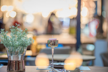 Flower vase and arrangement of dishes to prepare the use, the back floor has a beautiful bokeh, colorful background.