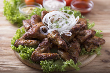 Barbecue chicken wings. Tasty grilled  chicken wings with marinated  onion