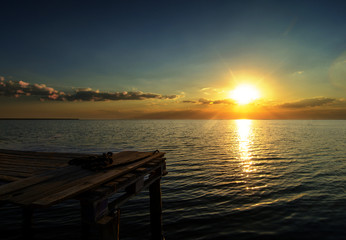 Obraz na płótnie Canvas Summer seascape. Sunset and pier.