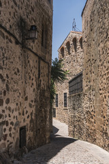 Typical narrow street of the old town of Caceres, Spain