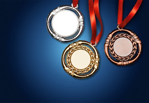 Gold, silver and bronze medals with ribbons