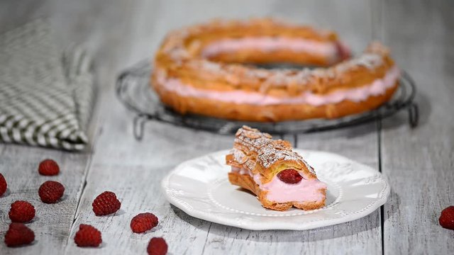 Homemade choux pastry cake Paris Brest with raspberries. French dessert.