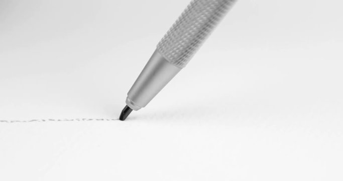 Artists hands drawing pencil writes line on paper