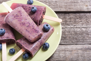 Popsicle with blueberries and yogurt