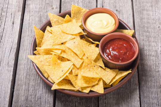 Crispy chips nachos with tomato and cheese sauce