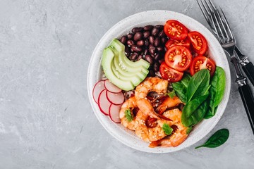 Spicy Shrimp Burrito Buddha Bowl with wild rice, spinach, radish,  tomatoes, black beans and avocado