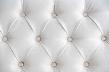 white texture background of leather sofa with buttons