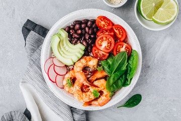 Spicy Shrimp Burrito Buddha Bowl with wild rice, spinach, radish,  tomatoes, black beans and avocado