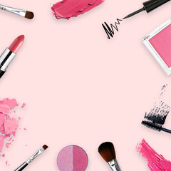 lipstick, tools, eyeliner, blush on, eye shadow and powder cosmetic in pink theme make up on frame for promotion