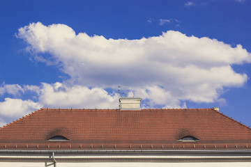 shingles red roof background symmetry concept for wallpaper in summer bright colorful day time with empty space for copy or text