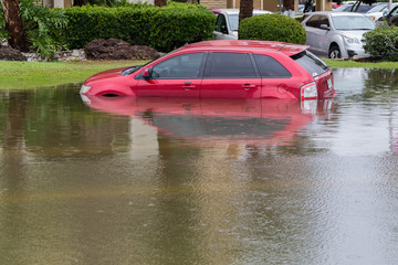 Cars submerged in Houston, Texas, US during hurricane Harvey. Water could enter the engine,...
