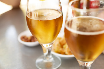 Beer glasses with plates to eat