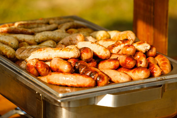 Homemade sausages from turkey (chicken) fried in a frying pan