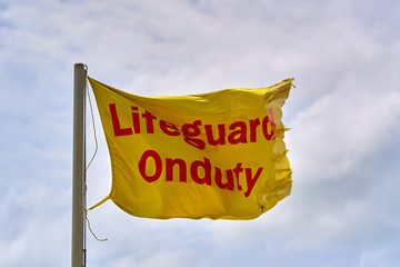 Lifeguard on duty - yellow flag on Patong beach. Low season in Phuket, Thailand.
