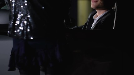 Driver in car touching prostitute outdoors, businessman looking for relaxation