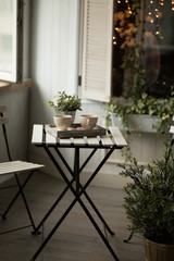 Two cups of tea or coffee on table at morning in loft interior